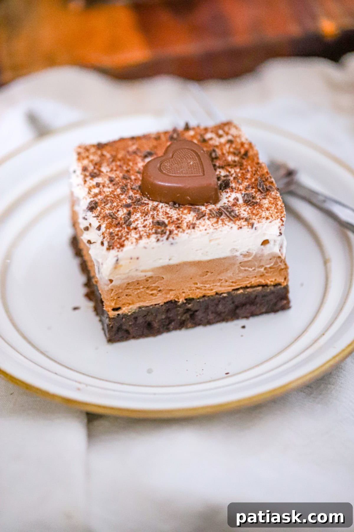 French silk pie brownies topped with whipped cream and chocolate shavings