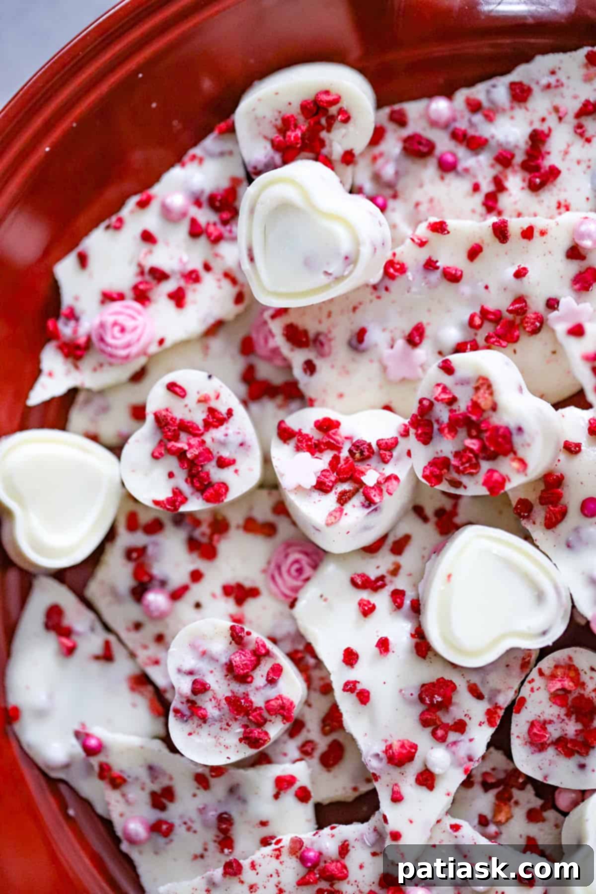 Raspberry White Chocolate Valentine's Day Delights 3 Freeze-dried raspberries being mixed into melted white chocolate